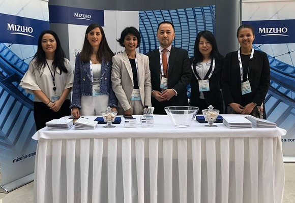 people standing behind a table